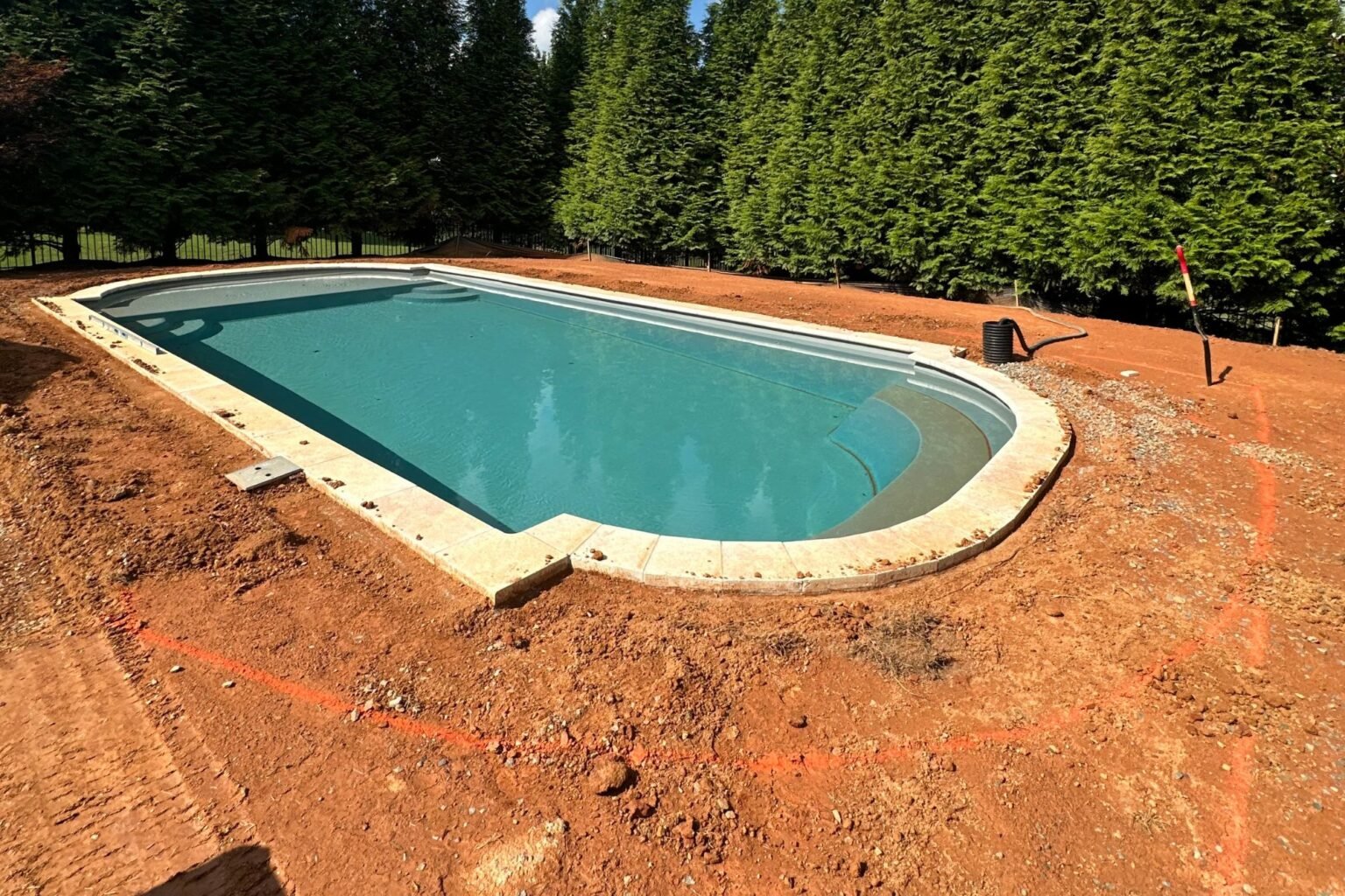 Poolside Paradise yard before the finished patio and sod