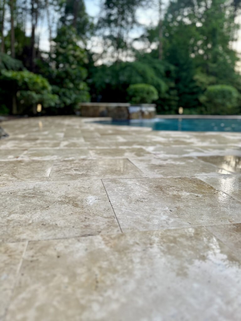 Close view of the travertine paver colors and surface texture