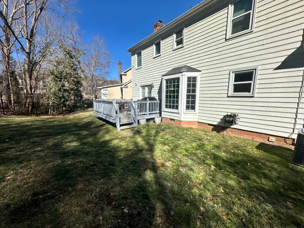 Original raised deck and lawn seen from an angled side view